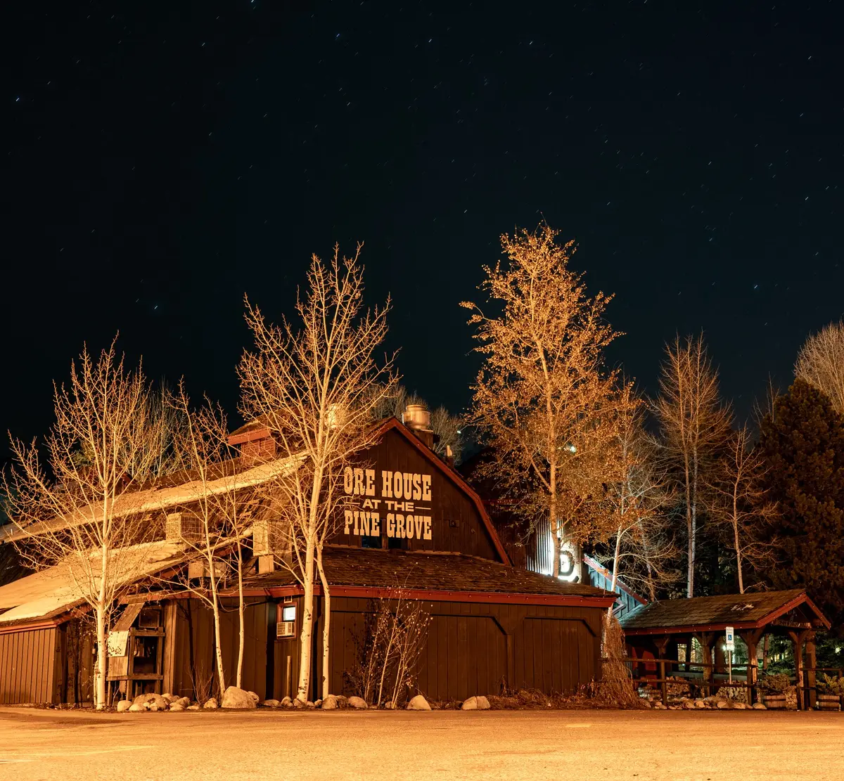 The historic Ore House barn lit up on a winter night