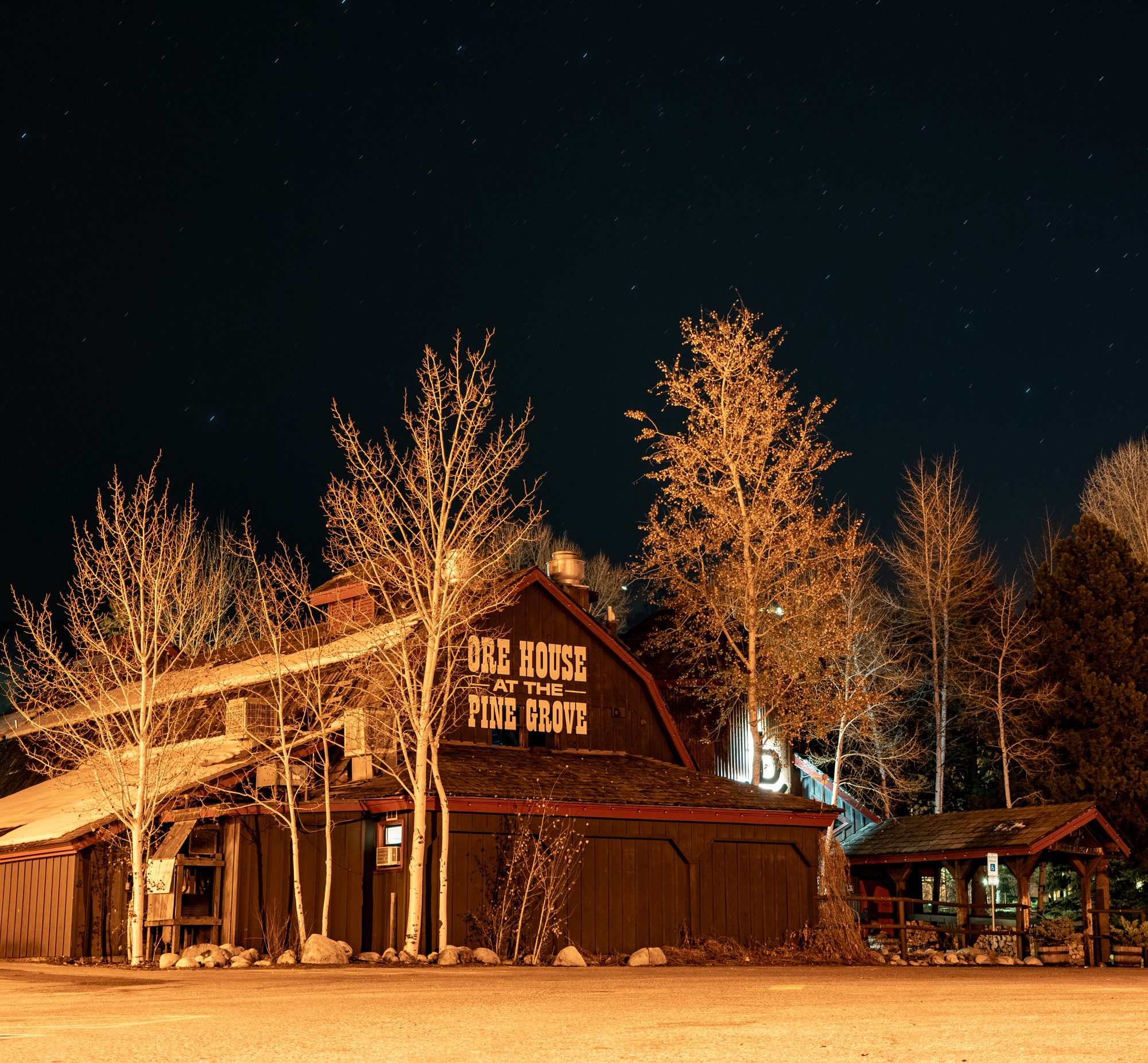 The historic Ore House barn lit up on a winter night
